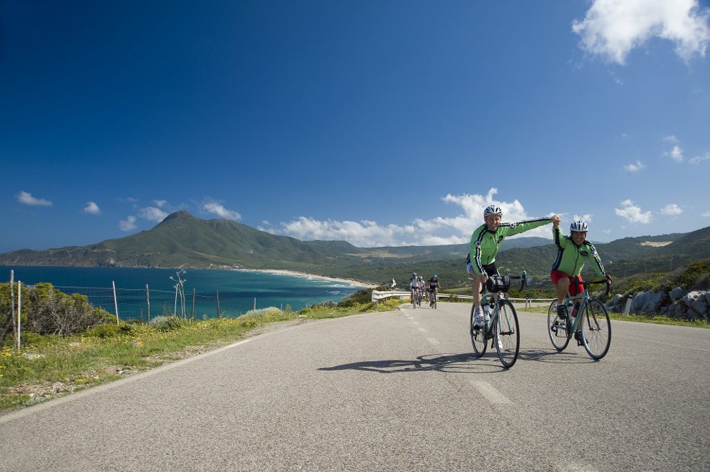 Happy cyclists on a bike trip in Sardinia