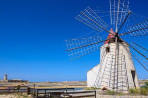 windmill on the saltworks near Trapani during a bike tour in Sicily